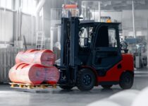 Forklift,Transports,Rolls,Of,Finished,Polyethylene,Bags,In,Plastic,Packaging Forklift,Transports,Rolls,Of,Finished,Polyethylene,Bags,In,Plastic,Packaging