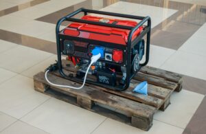 A,Gasoline,Electric,Generator,Stands,Indoors,On,A,Wooden,Pallet
