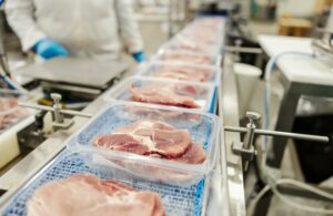 Close,Up,Of,A,Meat,On,A,Packing,Machine.